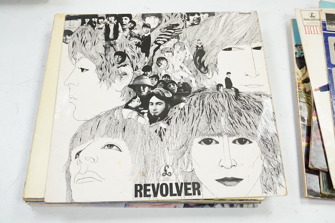 Fourteen LP record albums including eleven The Beatles and related; Sgt. Pepper’s Lonely Hearts Club Band (plus an additional three others), The Beatles at the Hollywood Bowl, Magical Mystery Tour, Revolver, etc., plus t